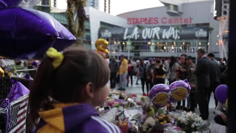 Young-Girl-at-Kobe-and-Gianna-Bryant-Staples-Center-Memorial,-Slow-Motion-Rack-Focus