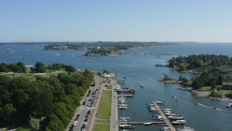 Sideways-aerial-dolly-of-docks-parks-and-islands-with-water-and-boat-trails