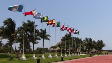 Flags-of-different-nations-in-the-wind-at-Puerto-Chiapas-cruise-ship-terminal,-Mexico