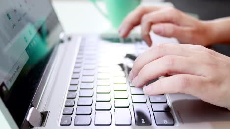 Feminine-Hands-Typing-Fast-On-Laptop-Keyboard---close-up
