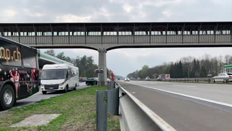 A-pedestrian-bridge-above-a-very-fast-highway-somewhere-in-southern-Germany-on-a-winter-afternoon