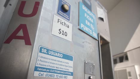 Close-up-of-vending-machine-selling-hot-water-for-mate,-Argentina