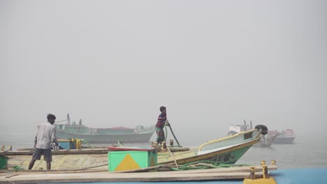 Bangladeshi-Labours-are-working-on-top-of-a-sand-trawler-with-mooring-ropes-during-winter