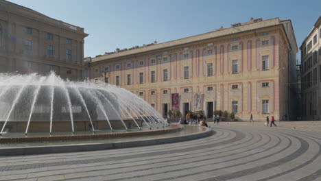 Genoa-Piazza-De-Ferrari-main-city-square,-Palazzo-Ducale-palace-and-fountain