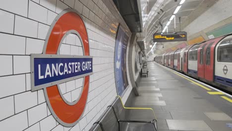 London-Central-Line-tube-train-leaving-an-empty-Lancaster-gate-station