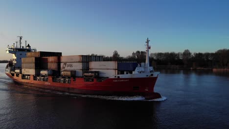 Container-Ship-On-Oude-Maas-River-Against-Blue-Sky