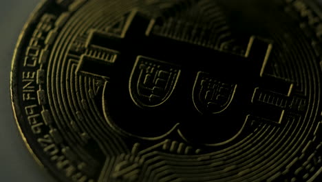 Virtual-currency-concept-detail-being-illuminated-and-one-of-its-sides
