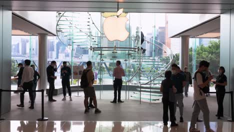 Shoppers-are-seen-at-the-American-multinational-technology-company-Apple-store-and-logo-on-the-first-weekend-after-the-launch-of-the-new-iPhone-13-series-smartphones-in-Hong-Kong