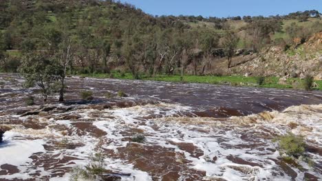 Whitewater-Flowing-Over-Rocks-At-Bells-Rapids,-Perth---Pan-Left-Shot