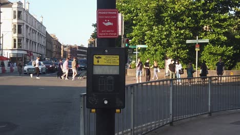 A-slow-motion-of-the-wait-light-turning-off-on-a-pedestrian-control-box