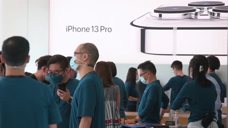 Customers-are-seen-purchasing-Apple-brand-products-at-an-Apple-store-during-the-launch-day-of-the-new-iPhone-13-series-smartphones-in-Hong-Kong