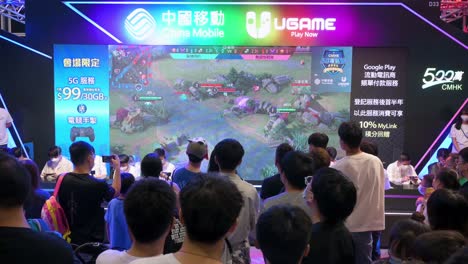 A-crowd-watches-a-live-streaming-game-played-during-the-Anicom-and-Games-ACGHK-exhibition-event-in-Hong-Kong