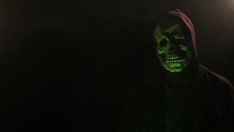 Scary-Skeleton-skull-head-figure-in-a-hood-for-Halloween-or-horror-videos