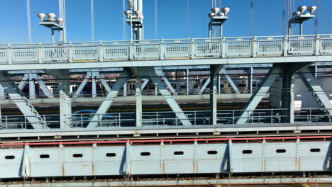 Side-view-of-cars-and-SEPTA-commuter-train-on-Ben-Franklin-Bridge