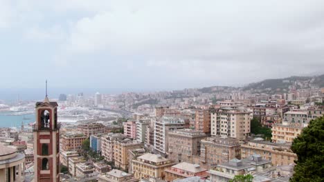 Rising-above-tree-top-revealing-majestic-city-of-Genoa,-aerial-cinematic-view