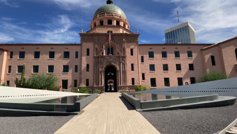 Old-Pima-County-Courthouse-with-new-The-Embrace-memorial-fountains,-remembering-the-Tucson-mass-shooting