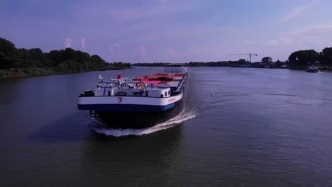 Aerial-Parallax-Across-Forward-Bow-Of-Comienzo-Cargo-Ship-Along-Oude-Maas