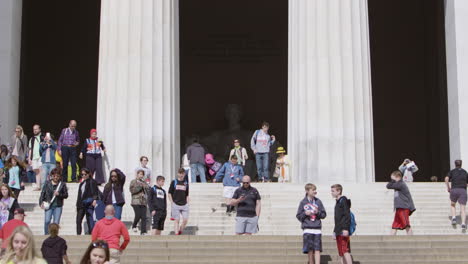 Tourists-at-the-Lincoln-Memorial,-telephoto-lens-in-slow-motion