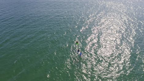 Kayakers-rowing-hobby-watersport-at-Marazion-aerial