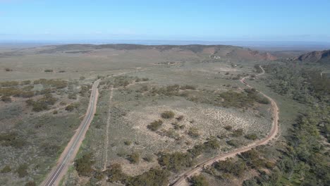 Aerial-flyover-Horrocks-pass-countryside-road-surrounded-by-vegetation,-South-Australia