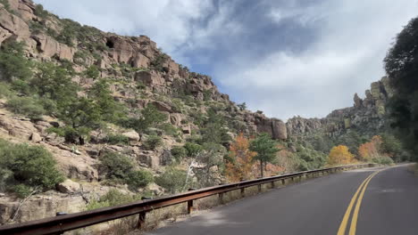 Scenic-road-through-Chiricahua-National-Monument-with-autumn-colors-on-trees