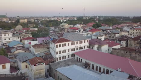 Low-aerial-flight-over-old-Zanzibar-with-new-area-seen-in-distance