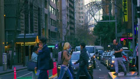 Cars-Yield-As-Pedestrians-Cross-The-Street-In-Sydney,-Australia