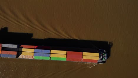 Aerial-Birds-Eye-View-Over-Cargo-Containers-On-Deck-Of-Sendo-Liner-Inland-Freighter-Along-Der-Lek-In-Groot-Ammers