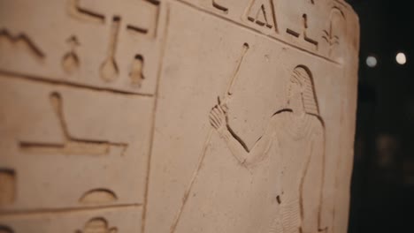 Close-up-of-Egyptian-hieroglyphics,-antique-alphabet-script-in-archaeology-site,-history-background