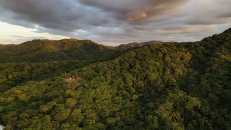 Cinematic-orbiting-drone-video-of-epic-cloudscape-over-private-property-on-a-mountain-ridge-within-lush-central-American-rainforest