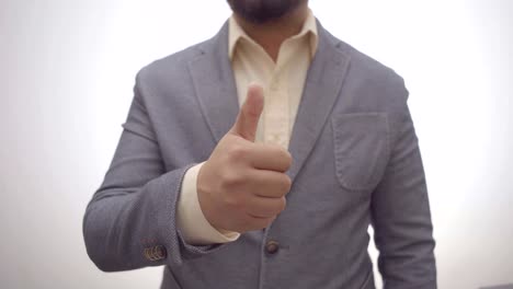 a-businessman-showing-thumbs-up