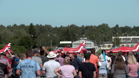 Crowd-Of-People-Taking-Videos-Of-Royal-Air-Force-Red-Arrows-Aerobatic-Team-On-The-Ground-In-Gdynia,-Poland