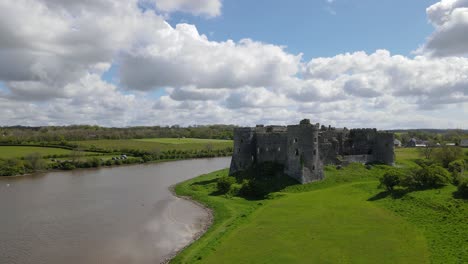 Riverside-Carew-Castle-and-green-shores,-Wales