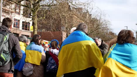 Group-of-people-meeting-at-Ukraine-anti-war-protest-activists-on-Manchester-city-street