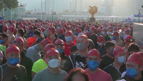 Over-1,500-participants-wearing-face-masks-wait-at-the-start-line-during-the-annual-cross-harbour-swimming-competition-New-World-Harbour-Race-in-Hong-Kong
