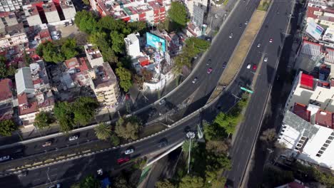 Tilt-Down-Shot-of-the-Escandon-Colony-and-the-Junction-of-Viaducto-and-Rio-Becerra-Avenues,-Mexico-City
