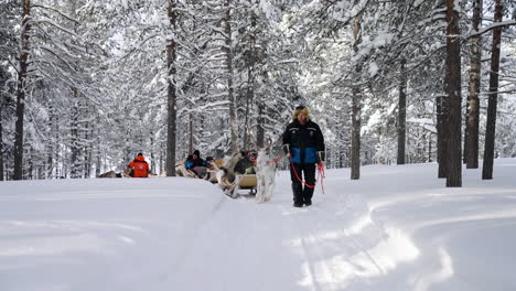 People-On-A-Reindeer-Ride-Activity-In-Muonio,-Finland-Near-Lapland-During-Winter-Season