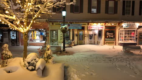 Storefronts-in-winter-snow-at-night