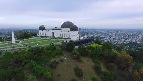 Aerial-Shot-of-Griffith-Observatory-and-Beautiful-Los-Angeles-Hazy-Skyline-Ahead