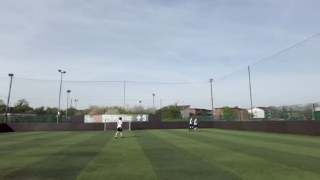 Teammates-Doing-Pre-Game-Jog-On-Soccer-Pitch-At-Goals-On-17-April-2022