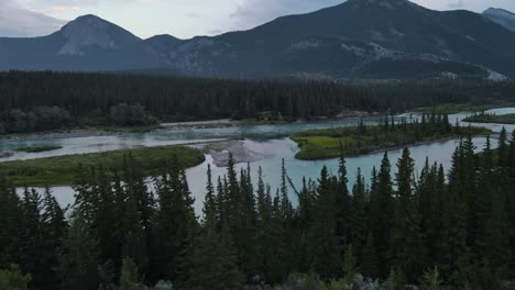 Stunning-Bow-River-flowing-through-the-Rocky-Mountains-at-blue-hour-in-Alberta,-Canada
