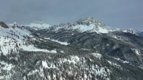 Wide-drone-Aerial-view-of-mountains-with-snow-in-winter