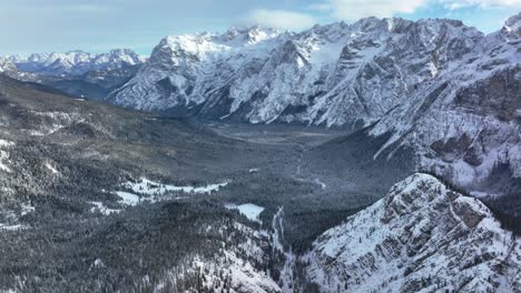 Wide-drone-Aerial-view-of-mountains-with-snow-in-winter