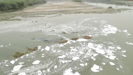 Chemical-foam-floats-on-the-Yamuna-River-in-New-Delhi