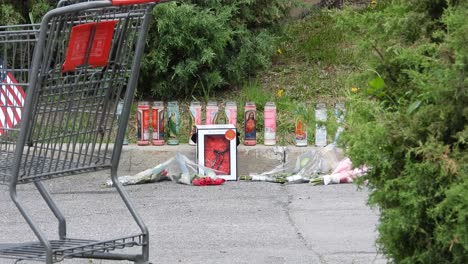 Candles-and-Flowers-from-a-victims-tribute-on-Tops-Supermarket-parking-lot