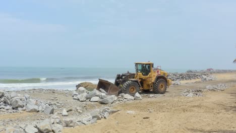 construction-of-sea-defences-with-loader-machine-tractor