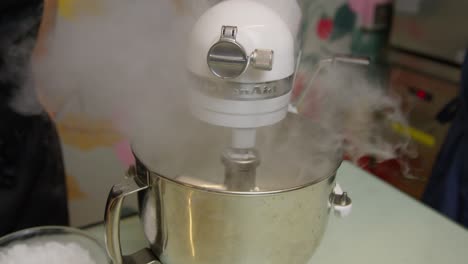 Adding-dry-ice-to-ice-cream-preparation-inside-stand-mixer