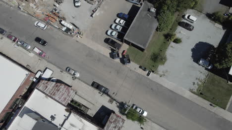 Aerial-drone-over-construction-site,-truck-drives-into-construction-zone