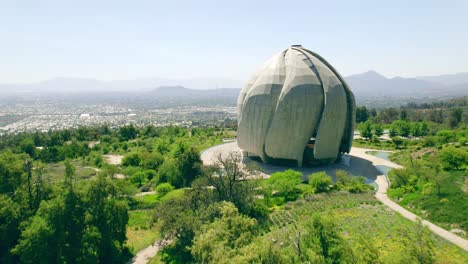 Aerial-view-dolly-in-the-spring-eclectic-garden-of-the-Bahai-Temple-of-South-America,-Santiago,-Chile