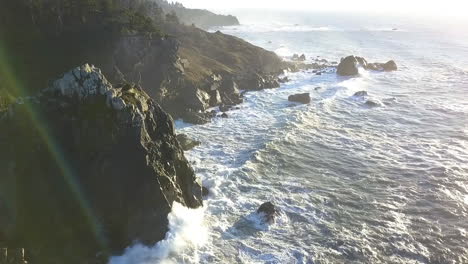 Aerial-drone-of-Sue-Meg-State-Park,-rocky-coastline,-cliffs,-and-waves,-Northern-California